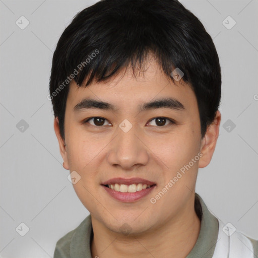 Joyful asian young-adult male with short  black hair and brown eyes