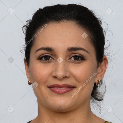 Joyful latino young-adult female with medium  brown hair and brown eyes