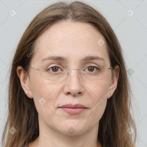 Joyful white adult female with long  brown hair and grey eyes