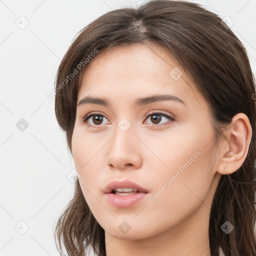 Neutral white young-adult female with long  brown hair and brown eyes