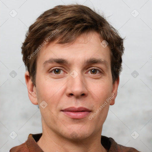 Joyful white adult male with short  brown hair and grey eyes