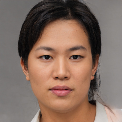 Neutral asian young-adult female with medium  brown hair and brown eyes