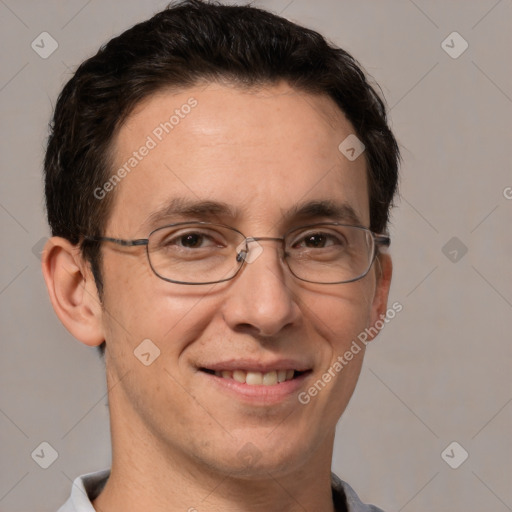 Joyful white adult male with short  brown hair and brown eyes