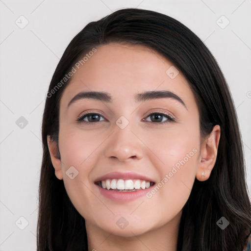 Joyful white young-adult female with long  black hair and brown eyes