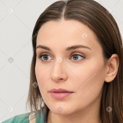 Neutral white young-adult female with long  brown hair and brown eyes