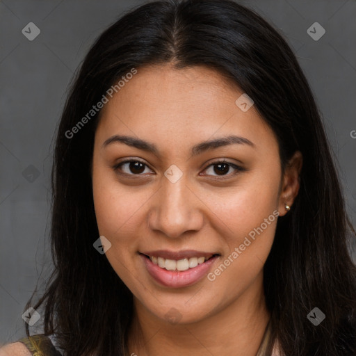 Joyful latino young-adult female with long  brown hair and brown eyes