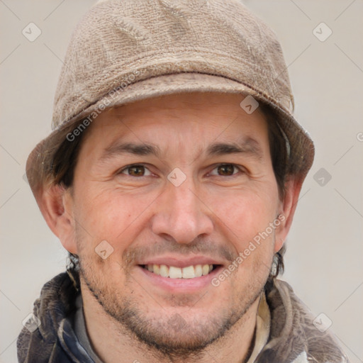 Joyful white adult male with short  brown hair and grey eyes