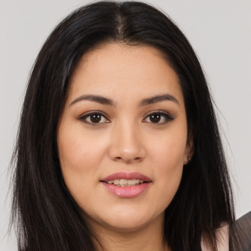 Joyful asian young-adult female with long  brown hair and brown eyes