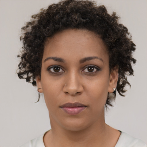 Neutral black young-adult female with short  brown hair and brown eyes