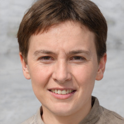 Joyful white adult male with short  brown hair and grey eyes