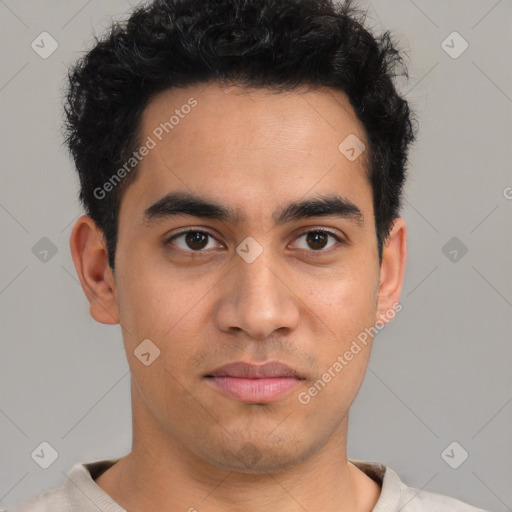 Joyful latino young-adult male with short  brown hair and brown eyes