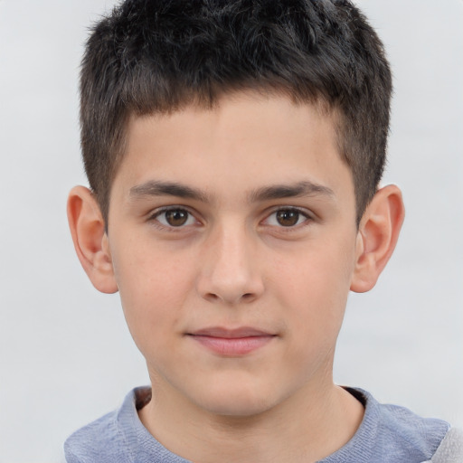 Joyful white child male with short  brown hair and brown eyes