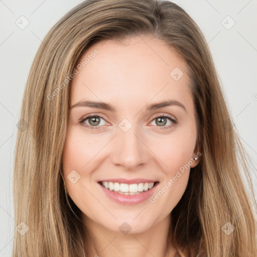 Joyful white young-adult female with long  brown hair and green eyes