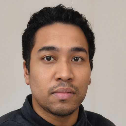 Neutral latino young-adult male with short  black hair and brown eyes