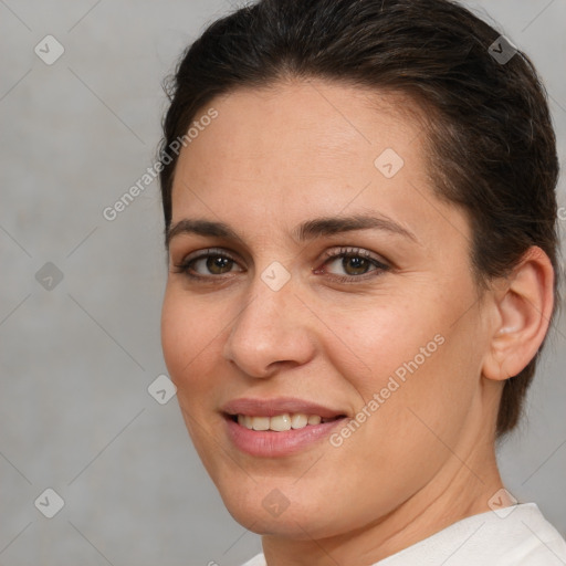 Joyful white young-adult female with medium  brown hair and brown eyes