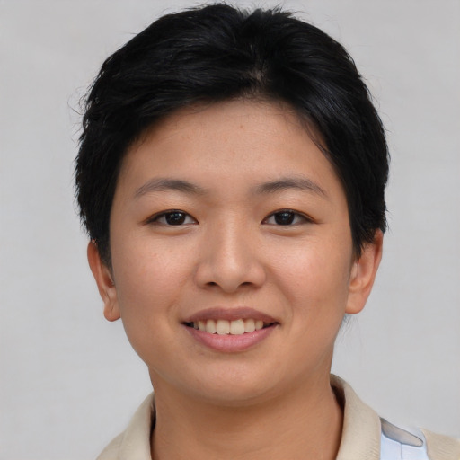 Joyful asian young-adult female with short  brown hair and brown eyes