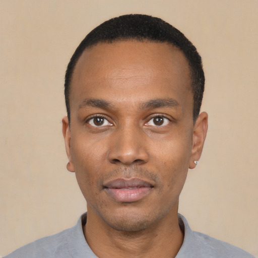 Neutral black young-adult male with short  black hair and brown eyes