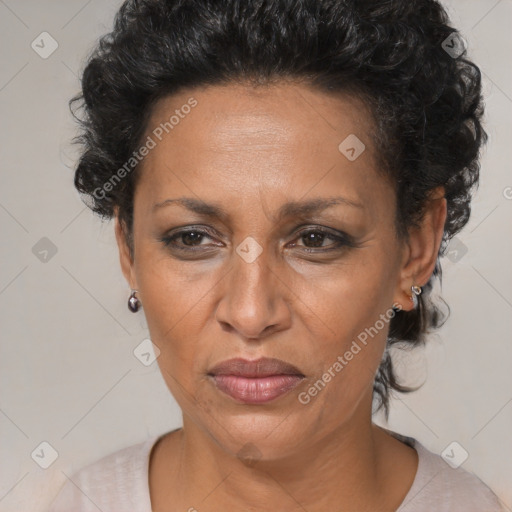 Joyful black adult female with short  brown hair and brown eyes