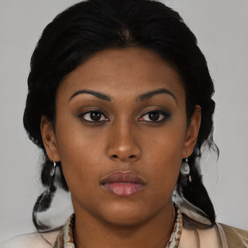 Neutral black young-adult female with medium  black hair and brown eyes