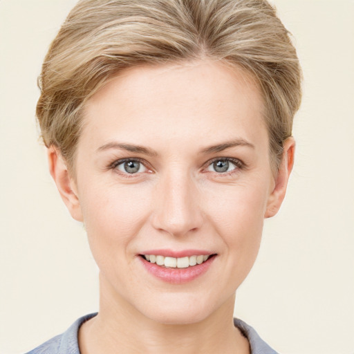 Joyful white young-adult female with short  brown hair and grey eyes