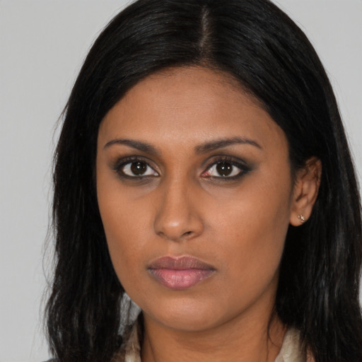 Neutral black young-adult female with long  brown hair and brown eyes