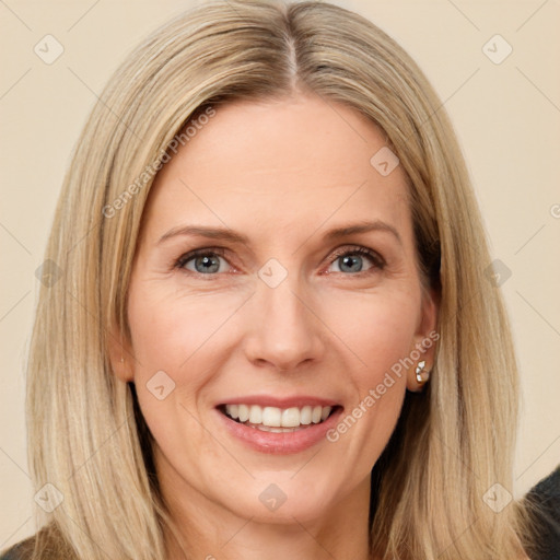 Joyful white adult female with long  brown hair and brown eyes