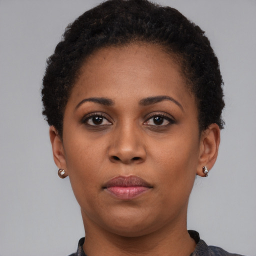 Neutral black young-adult female with short  brown hair and brown eyes