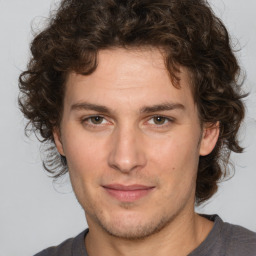 Joyful white young-adult male with medium  brown hair and brown eyes