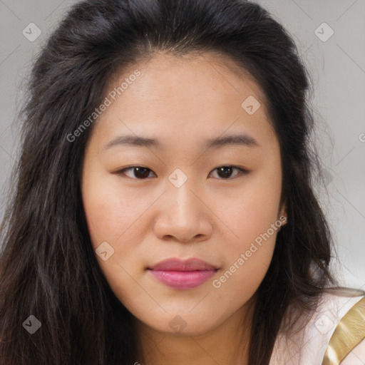 Joyful asian young-adult female with long  brown hair and brown eyes