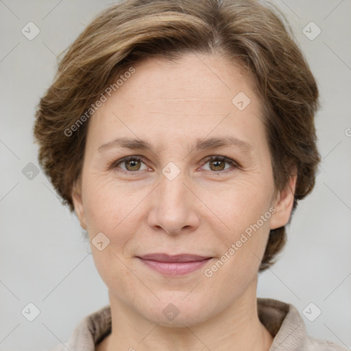 Joyful white adult female with short  brown hair and grey eyes