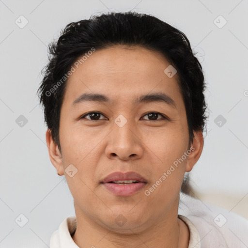 Joyful asian young-adult male with short  brown hair and brown eyes