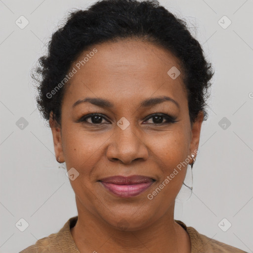 Joyful black adult female with short  brown hair and brown eyes