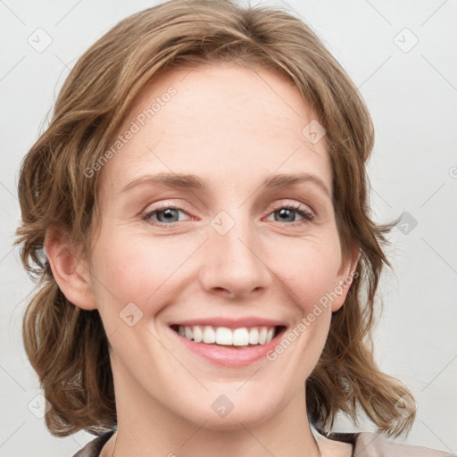 Joyful white young-adult female with medium  brown hair and blue eyes