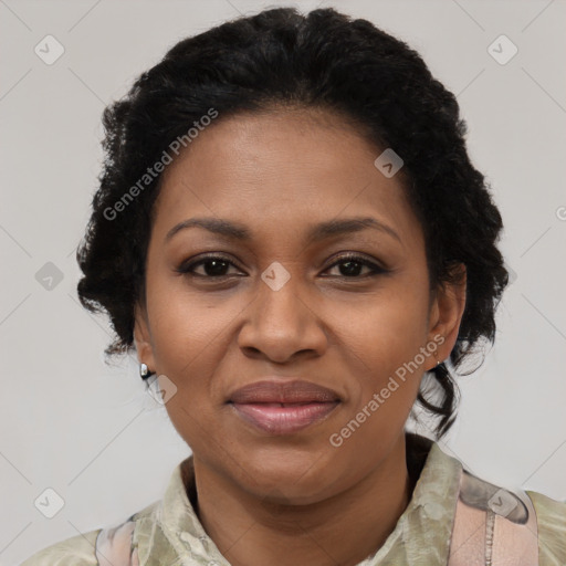 Joyful black adult female with short  brown hair and brown eyes