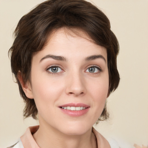 Joyful white young-adult female with medium  brown hair and green eyes