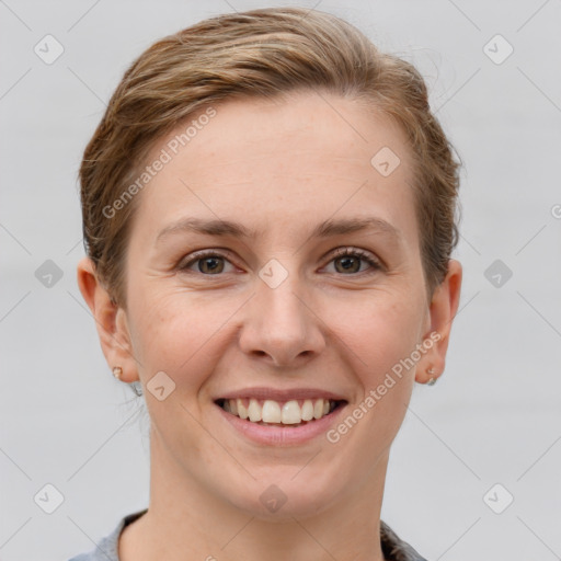 Joyful white young-adult female with short  brown hair and grey eyes