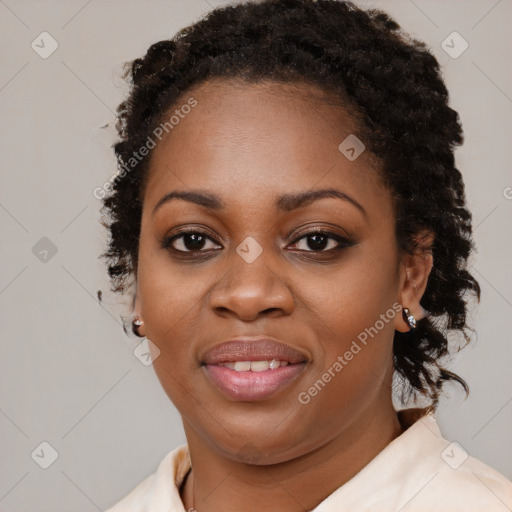 Joyful black young-adult female with medium  brown hair and brown eyes