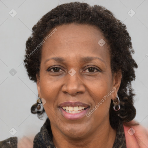 Joyful black adult female with short  brown hair and brown eyes