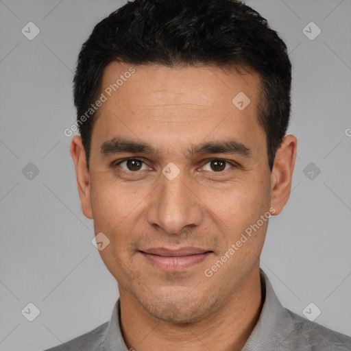 Joyful white young-adult male with short  black hair and brown eyes