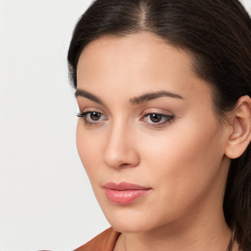 Neutral white young-adult female with long  brown hair and brown eyes