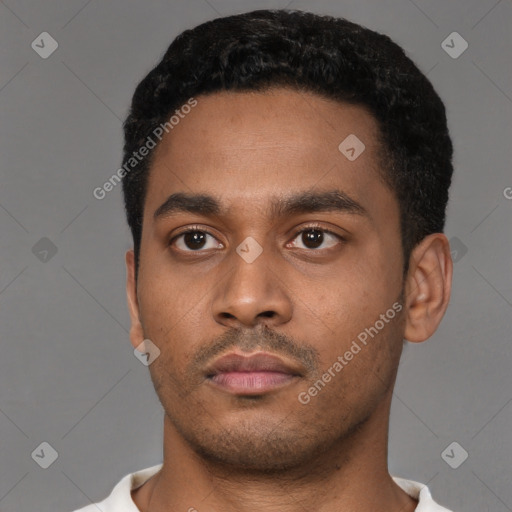 Neutral latino young-adult male with short  black hair and brown eyes