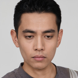 Neutral asian young-adult male with short  black hair and brown eyes