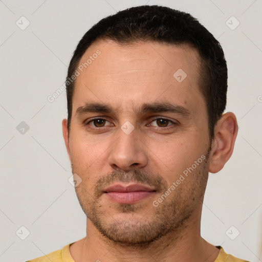 Joyful white young-adult male with short  brown hair and brown eyes