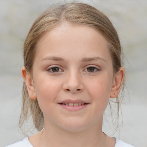 Joyful white child female with medium  brown hair and brown eyes