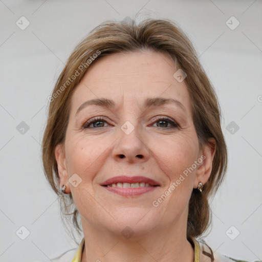 Joyful white adult female with medium  brown hair and brown eyes