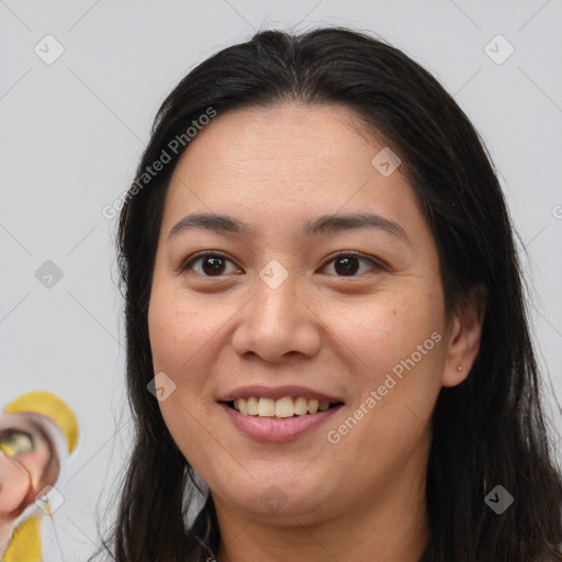 Joyful white young-adult female with long  brown hair and brown eyes