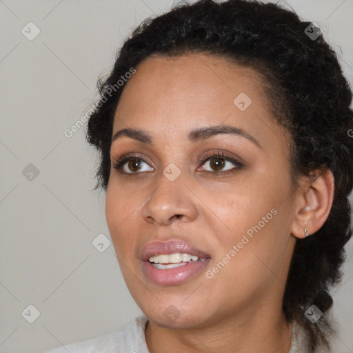 Joyful black young-adult female with medium  black hair and brown eyes