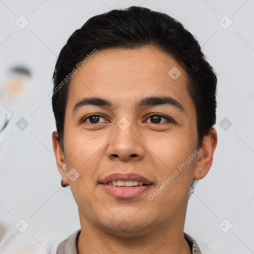 Joyful latino young-adult male with short  brown hair and brown eyes