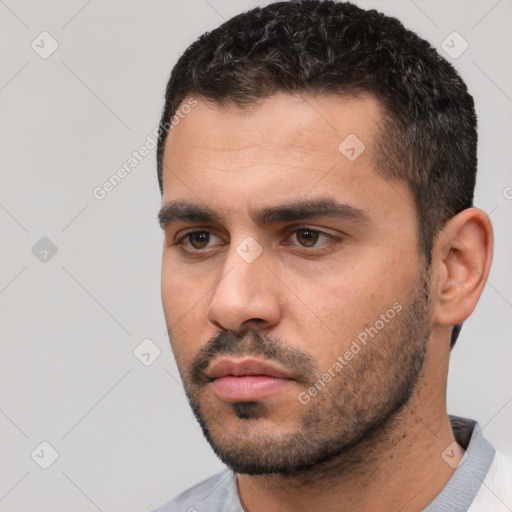 Neutral white young-adult male with short  black hair and brown eyes