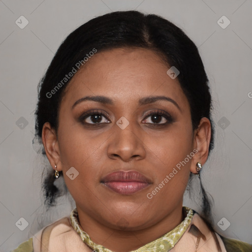 Joyful latino young-adult female with medium  brown hair and brown eyes